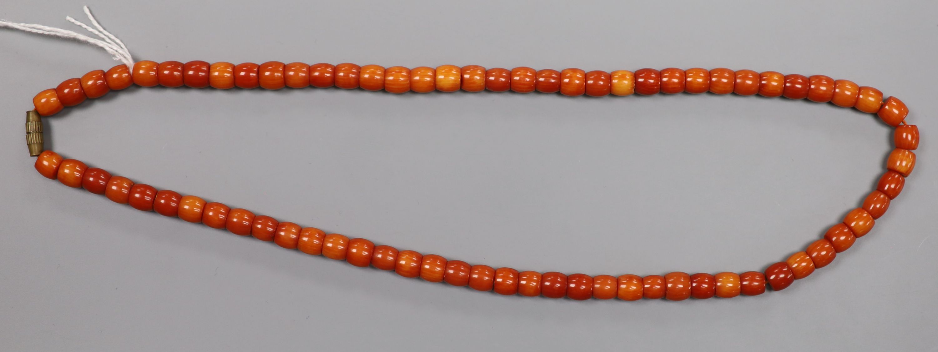 A single strand coral bead necklace, with gilt metal barrel clasp, 50cm, gross 52 grams.